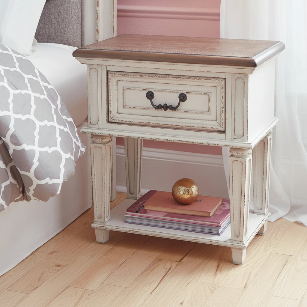 Wooden nightstand with a lamp, glass, and decorative items in a bedroom setting.