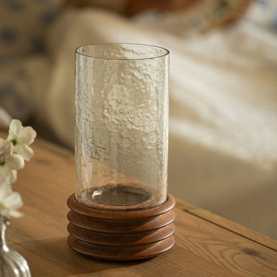 حامل شموع زجاجي وخشبي