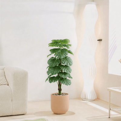 |Artificial Alocasia Heart Leaf Tree in a cylindrical plastic pot featuring large, symmetrical leaves. Number of branches: 1 Tub type: Durable plastic Tub shape: Cylindrical Available colors: camel spray - Al Rugaib Furniture