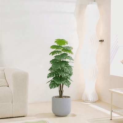 |Artificial Alocasia Heart Leaf Tree in a cylindrical plastic pot featuring large, symmetrical leaves. Number of branches: 1 Tub type: Durable plastic Tub shape: Cylindrical Available colors: gray spray - Al Rugaib Furniture