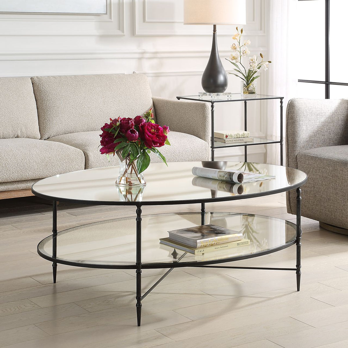 Henzler 93 W x 48 H x 134 D Black Oval Coffee Table with Mirror Top Coffee Tables| Uttermost
