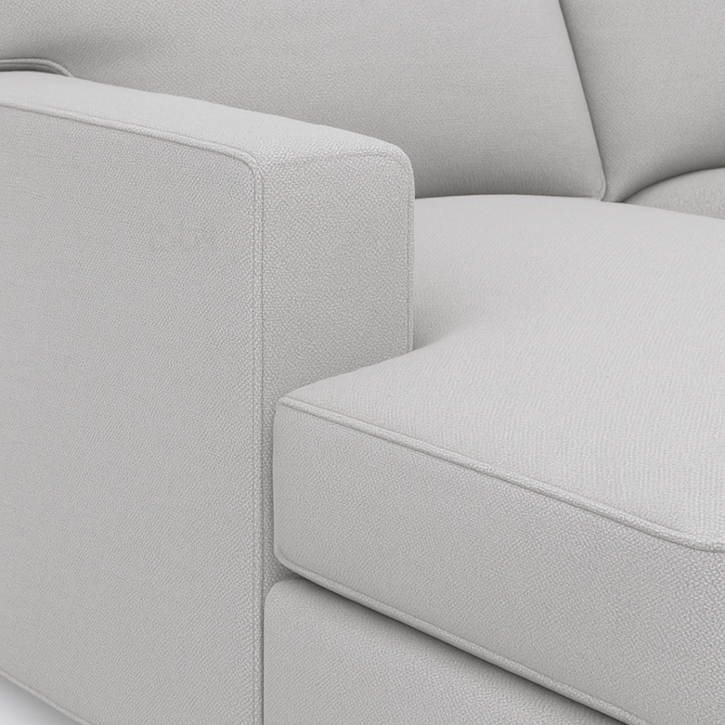 Isla- Sectional Sofa in two corners with a brown cabinet.