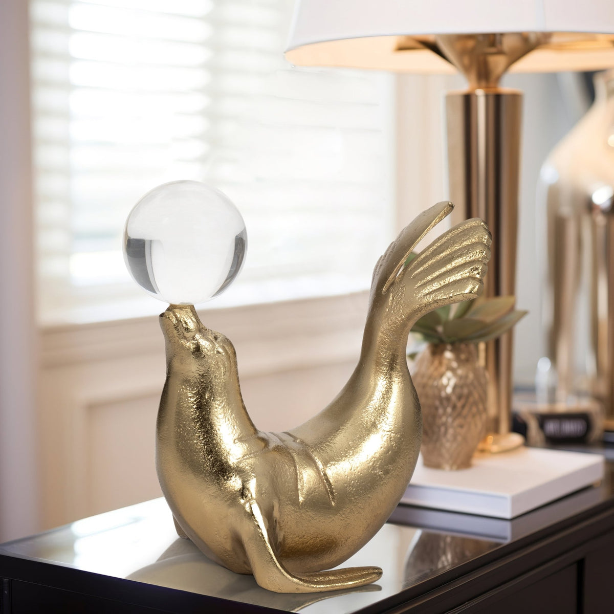 Metal, 7" Sea Lion W/ Acrylic Ball, Gold Table Decors| Sagebrook Home