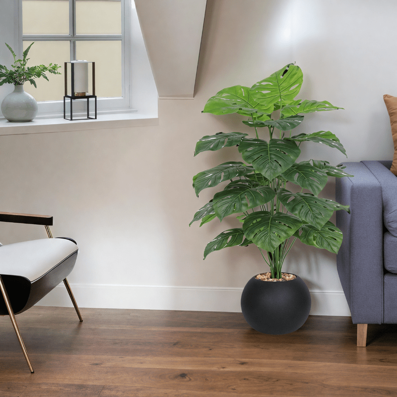 Monstera Leaf Tree with Round Plastic Stand Consists of 24 Branches Available Colors: Black - Al Rugaib Furniture