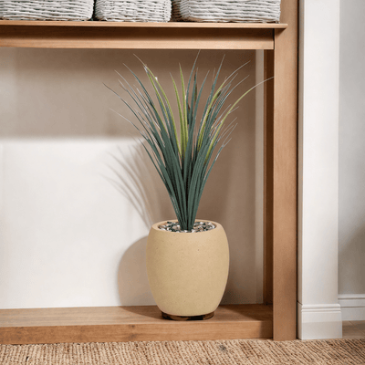 Yucca cactus tree with a fiberglass oval base consisting of a single branch, designed with green leaves that add a lively touch. Available colors: camel spray. - Al Rugaib Furniture