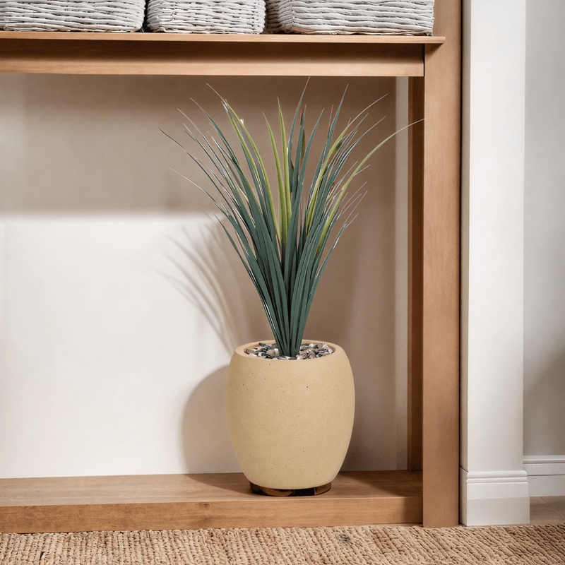 Yucca cactus tree with a fiberglass oval base consisting of a single branch, designed with green leaves that add a lively touch. Available colors: camel spray. - Al Rugaib Furniture