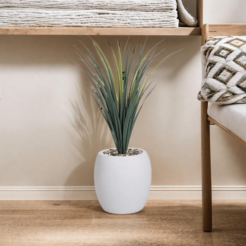 Yucca cactus tree with a fiberglass oval base consisting of a single branch, designed with green leaves that add a lively touch. Available colors: white Artificial Plants| Otath
