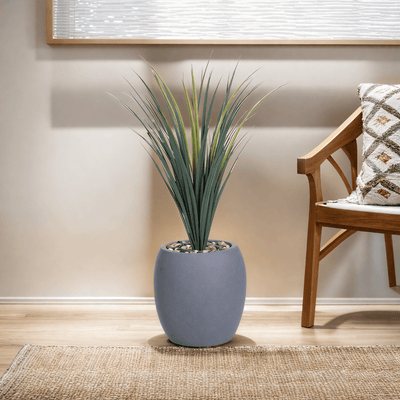 Yucca cactus tree with a fiberglass oval base consisting of a single branch, designed with green leaves that add a lively touch. Available colors:gray spray - Al Rugaib Furniture