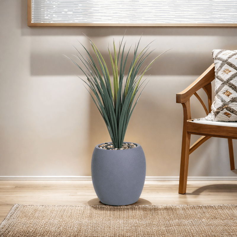 Yucca cactus tree with a fiberglass oval base consisting of a single branch, designed with green leaves that add a lively touch. Available colors:gray spray - Al Rugaib Furniture