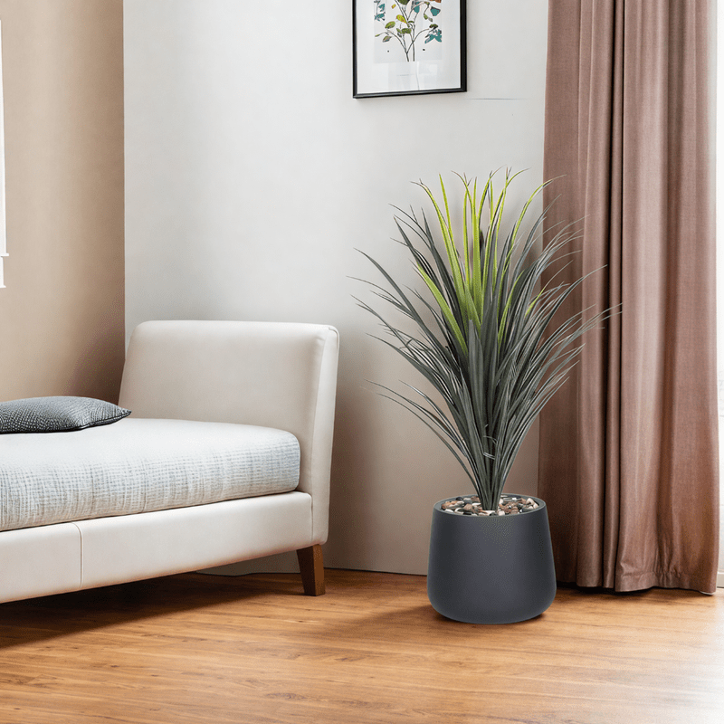 Yucca cactus tree with oval fiber pot consisting of a single branch, designed with green leaves that add a lively touch. Available colors: black. - Al Rugaib Furniture