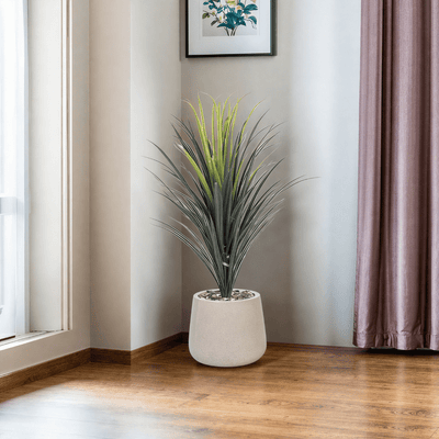 Yucca cactus tree with oval fiber pot consisting of a single branch, designed with green leaves that add a lively touch. Available colors: torabi spray. - Al Rugaib Furniture